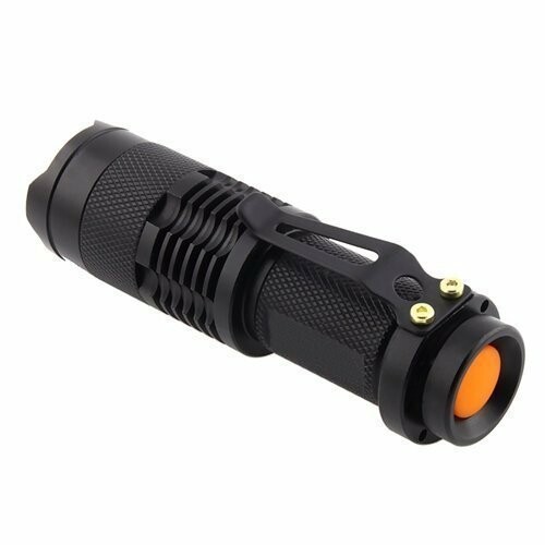 Black portable flashlight with orange button