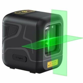 Black laser level tool projecting green lines