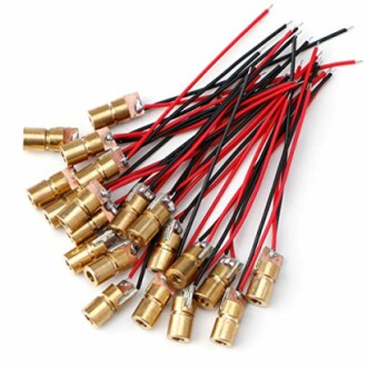 Collection of brass laser modules with red and black wires.