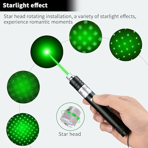 Hand holding a laser pointer with green starlight effects and interchangeable star head.